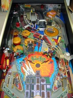 Image # 10151: The Addams Family Special Collectors Edition Playfield 
(Note that this machine includes a custom thing hand decal on thing's box, an Uncle Fester figurine in the electric chair, as well as a custom backdrop.)
