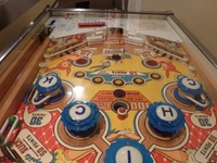 Image # 58320: Slick Chick Playfield - Downfield View 
(This playfield shows the factory-correct placement of the 'one-sided' plastic ball guides on the rubbered posts below each flipper.)