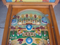 Image # 48759: Sluggin' Champ 'Deluxe' Upper Playfield 
(All plastic parts on this playfield are reproduction, as is the blue tray liner, but we show this image to present the playfield art and cabinet design.)