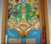 Image # 48760: Sluggin' Champ 'Deluxe' Lower Playfield 
(All plastic parts on this playfield are reproduction, as is the blue tray liner, but we show this image to present the playfield art and cabinet design.)
