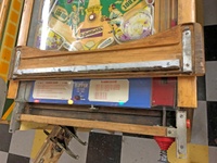 Image # 71657: Sluggin' Champ Under 'Deluxe' Lockdown Bar 
(The blue apron and the two cards mounted in it are reproductions. Serial number 064265 SC.)