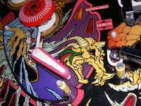 Image # 53363: Sorcerer Upper Skull - Red and Green Feathers 
(Robe is royal purple with pink trim.)