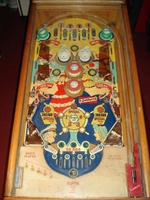 Image # 40594: Southern Belle Sample Game - Playfield 
(The flat light shield plastics on this game are extremely heat-damaged. The upper arch rebound rubber has melted. Serial number 7716.)