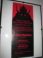 Image # 43652: Space Invaders Promotional Poster 
(The poster inside the frame measures 10 cm by 23 cm.)