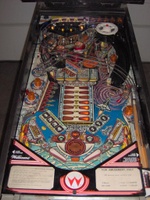 Image # 37259: Space Station Illuminated Playfield 
(The bottom pop bumper cap is missing the round decorative attachment that is seen on the other two caps.)