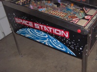 Image # 37260: Space Station Cabinet - Left 
(The bottom pop bumper cap is missing the round decorative attachment that is seen on the other two caps.)
