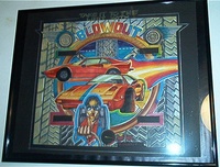 Image # 64072: Spy Hunter Original Backglass Artwork 
(Artist is Tony Ramunni.Color markers were used.Dimensions 13 inches by 14 1/4 inches excluding frame and matte border. Metal frame is 16 1/2 by 20 1/2 inches.)