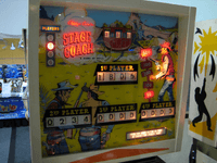 Image # 83567: Stage Coach Illuminated Backglass - Press Gun Smoke Button 
(The backbox has been repainted. Serial number 2031. Photographed at the 2014 Northwest Pinball and Arcade Show.Photographed at the 2014 Northwest Pinball and Arcade Show.)