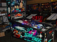 Image # 50178: Star Trek: The Next Generation Prototype - Full View 
(The cabinet art is silkscreened directly onto the wood. No decals were used. Serial number 50223079272 with Date of Manufacture of 09/23/93.)