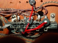 Image # 43671: Sunset Manufacturer Design Flaw 
(The manufacturer's placement of the replay plug assembly over a lamp hole prevented a backglass lamp from being installed. Serial number 05530.)