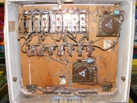 Image # 49835: Super Duo Inside Backbox 
(Just below the Point Score Adjustment tag are some holes where something was once mounted, probably a bell. Serial number 04002.)