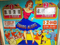 Image # 77511: Swing-Along Plastic Backglass - Modified in Italy 
(For each player, the silkscreened '1' has been replaced with a functioning score reel.)
