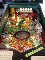 Image # 34242: Tee'd Off Illuminated Playfield 
(The 'tees' that support the five golf balls are missing in this image. This is a regular production game.)