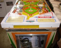 Image # 61867: Big Hit Playfield Edge - Yellow Version 
(This view shows the playfield is composite, not plywood. Serial number 03505.)