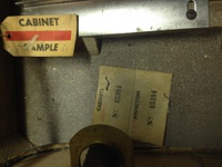 Image # 60024: 3 Jokers Sample Game - Cabinet Serial Number Tags 
(The cabinet is tagged '3 Jokers' with serial number 65384. The Sample motor board is tagged 'Straight Flush' with a handwritten serial number 61.)