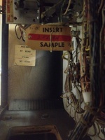 Image # 60020: 3 Jokers Sample Game - Backbox Serial Number Tags 
(The backbox is tagged '3 Jokers' with serial number 65382. The Sample insert is tagged 'Straight Flush' with a two-digit handwritten serial number.)