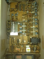 Image # 60022: 3 Jokers Sample Game - Motor Board 
(The cabinet is tagged '3 Jokers' with serial number 65384. The Sample motor board is tagged 'Straight Flush' with a handwritten serial number 61.)