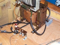 Image # 40712: Trade Winds Rectifier Replacement 
(Genco's selenium rectifier (gray unit on top of transformer, Genco did not put a bridge rectifier in it) in this game failed and so was jumpered out of the circuit and replaced by a new bridge rectifier, using the black wires. Serial number A3958.)