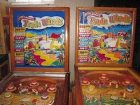Image # 62869: Trade Winds Backglass Comparison 
(The silver trim around the left playfield is spray paint added by a previous owner.)