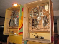 Image # 62882: Trade Winds Inside Backbox Comparison 
(The taller backbox on the right has an after-factory placement of a white chime box and a relay.)