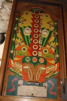 Image # 53492: Tri-Score Playfield 
(The two white posts in center playfield were added after this game left the factory. The two triangular plastics at the bottom of the playfield should be pointing downward. The rebound rubber beneath it is not angled like this plastic..)
