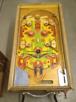 Image # 63293: Tumbleweed Playfield 
(A large round rollover button insert is missing in the lower playfield. The rubbers and bumper caps are also missing.)