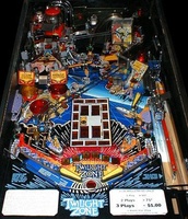 Image # 3186: Twilight Zone Playfield 
(Note that the pop bumper caps do not match those shown in the flyer and do not match those awarded via the skill shots.)