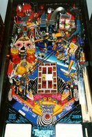 Image # 3202: Twilight Zone from WMS Mfg. 
(1 of 2 original design prototypes built directly from the whiteboard design. It is believed the picture of this prototype is from the game that stood in Ted Estes' office during the software design phase of development. Note that the bumper cap colors shown in this picture match the skill shot awards.)