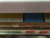 Image # 60959: Volley Sample Game - Playfield Overlay 
(In this image, the playfield has been lifted up, to just above the front edge of the cabinet, then the white cardholder has been raised up from the playfield to reveal the overlay's edge. Serial number 01016 S.)