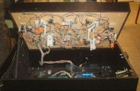 Image # 25719: War Under Playfield 
(This playfield version has two kick-out holes.)