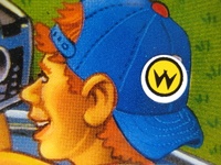 Image # 41948: Whirlwind Translite Detail - Williams Logo Sticker 
(This adhesive sticker was applied directly onto the translite. From a game with serial number 574 I335770.)