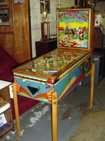 Image # 37535: Wild West Cabinet - Right 
(The right side of the lower cabinet shows a shift of color from dark blue to light blue. This light blue extends to the cabinet front. The remainder of the cabinet shows dark blue. The owner did not explain the reason for the lighter blue color.)