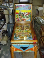 Image # 37536: Wild West Cabinet - Front View 
(The right side of the lower cabinet shows a shift of color from dark blue to light blue. This light blue extends to the cabinet front. The remainder of the cabinet shows dark blue. The owner did not explain the reason for the lighter blue color.)