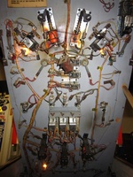 Image # 57999: Wild Wheels Under Playfield 
(The right flipper coil is dangling loose in this picture.)