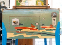 Image # 77432: Wisconsin Cabinet - Front - Rolldown Version 
(The manufacturer produced this game with a wood console base but an owner replaced it with the legs shown here. Serial number 3392.)
