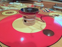 Image # 66439: World Fair Cardboard Spacer 
(The factory placed a cardboard ring to fill the space between the playfield and the bottom edge of this plastic bumper.)