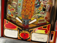 Image # 71596: Evil Fight Lower Playfield 
(The hole from one of two missing star rollover inserts can be seen in this image.)