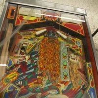 Image # 71599: Evil Fight Lower Playfield - Downfield View 
(The hole from one of two missing star rollover inserts can be seen in this image.)