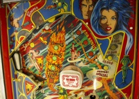 Image # 71593: Evil Fight Upper Playfield 
(The hole from one of two missing star rollover inserts can be seen in this image.)
