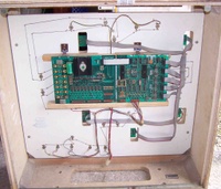 Image # 37388: Gun Men Inside Backbox 
(There are two boards shown here and connected to each other with a white ribbon cable.)