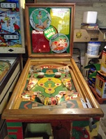 Image # 63524: Hits and Runs Cabinet - Front View 
(The left-side ballplayer figurine is not original to this game. Serial number A1283.)