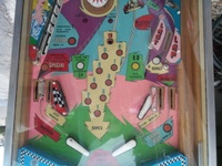 Image # 60073: Last Lap Lower Playfield 
(The pop bumper cap is not original to this game.)
