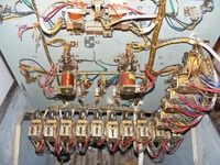 Image # 64254: Miss Universo (3 Ladies) Under Upper Playfield 
(We do not know what used to be attached to the seven clipped wires shown in the upper left corner of this image.)