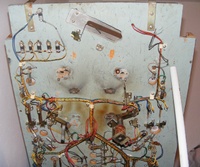 Image # 64255: Miss Universo (3 Ladies) Under Lower Playfield 
(The flipper mechanisms and outhole mechanism have been removed. The left slingshot coil has been removed. Two rollover lane switches on the right have been removed.)