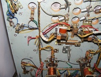 Image # 64256: Miss Universo (3 Ladies) Under Playfield - Detail 
(We do not know what used to be attached to the seven clipped wires shown here.)