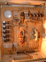 Image # 55869: Supersonic Early Production Inside Backbox 
(The sound card and speaker were removed at some point, revealing a round hole. Nearby is the jack for it, from which an after-factory white cable and wire extends to the lower cabinet to a Gottlieb EM chime unit. The add-a-ball option jack was not installed at the factory. The ball-in-play light bulb sockets were not installed for balls 6 through 10. Serial number 0003.)