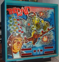 Image # 39675: The Raid Backglass 
(This backglass had been broken in several places and is glued together.)