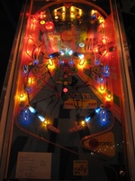 Image # 54289: West Club Illuminated Playfield 
(The top left round yellow rebound rubber is from Bally. The round yellow rebound rubbers at each outlane are from Williams. These parts are not original to this game.)