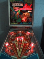 Image # 22678: Red Show Illuminated Front View 
(On this playfield, the inlane wireforms have been moved from their factory positions to transform the outlanes into additional inlanes. )