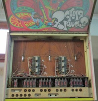 Image # 70609: Flower's Child Backglass in Service Position 
(Three festoon lamps illuminate the backglass.)
